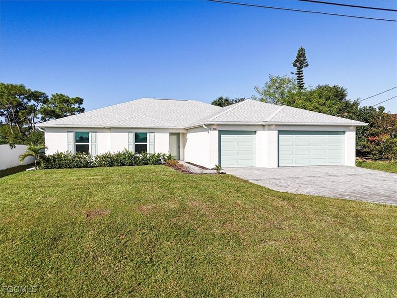 Front exterior of a new home in Cape Coral, Cape Coral, FL, highlighting curb appeal (Image 21).