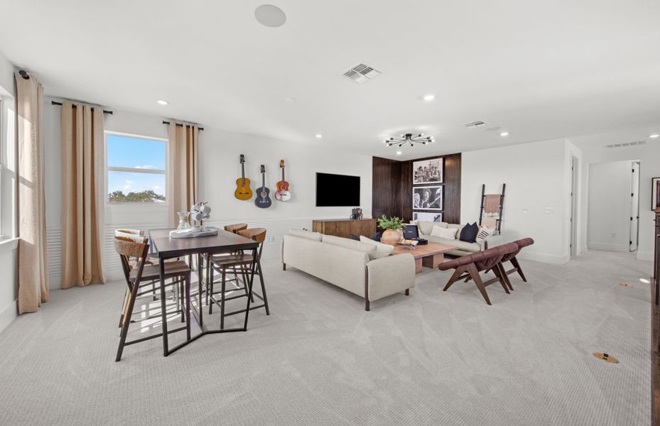 Representative furnished interior of a home built from the Layton Grande by DiVosta in BeachWalk by Manasota Key, Englewood (Image 12).
