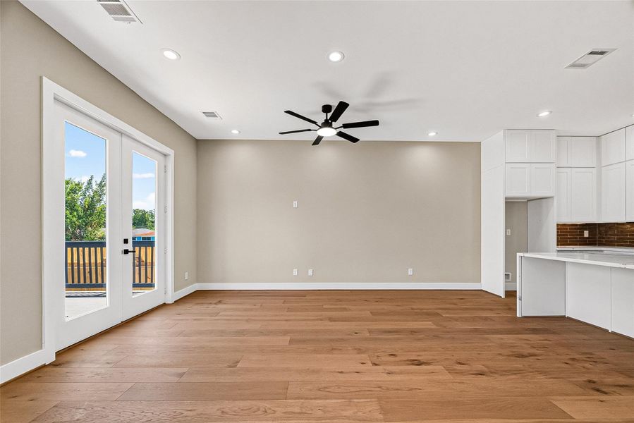 Spacious family room featuring an open-concept layout that flows seamlessly into the kitchen. Spacious family room featuring an open-concept layout that flows seamlessly into the kitchen.