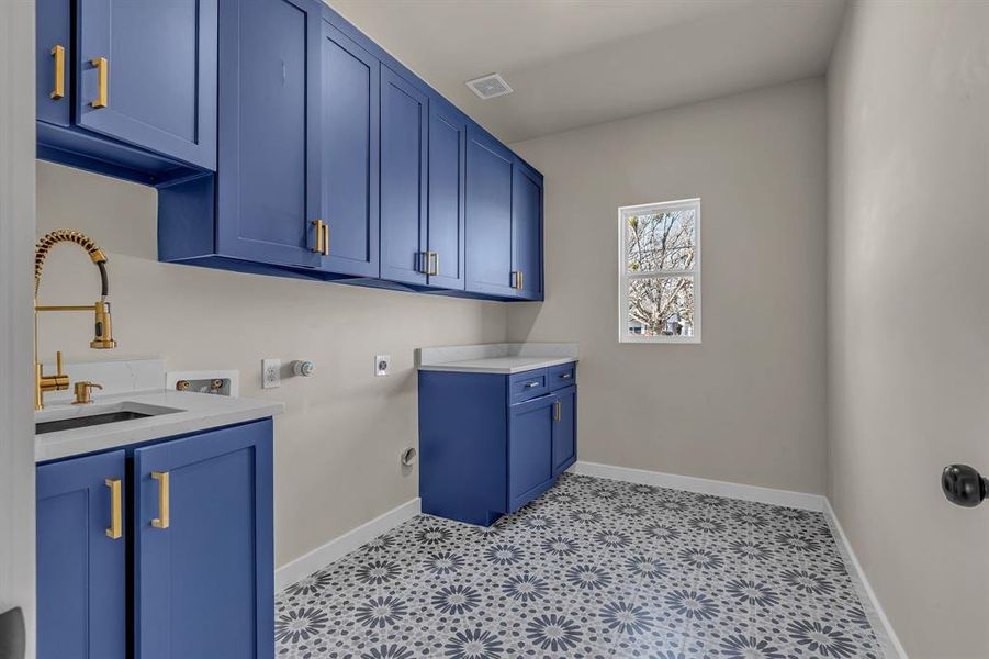 Laundry room with sink, cabinets, hookup for a gas dryer, hookup for a washing machine, and electric dryer hookup