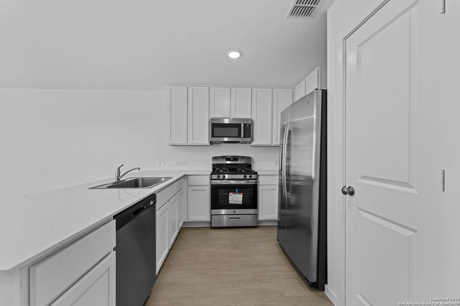 Furnished interior view inside a new home in Torian Village: Belmar Collection, San Antonio (Image 7).