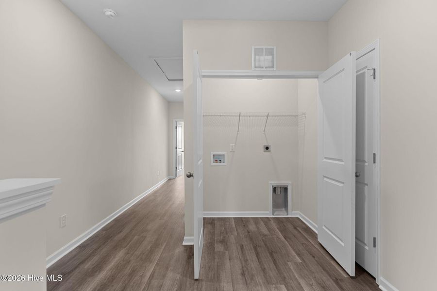 Spacious, unfurnished interior of a new home in Coastal Haven Townes, Leland (Image 9).