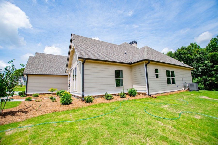 Exterior details and patio area of a home in WOODMONT RESERVE, Roopville (Image 36).