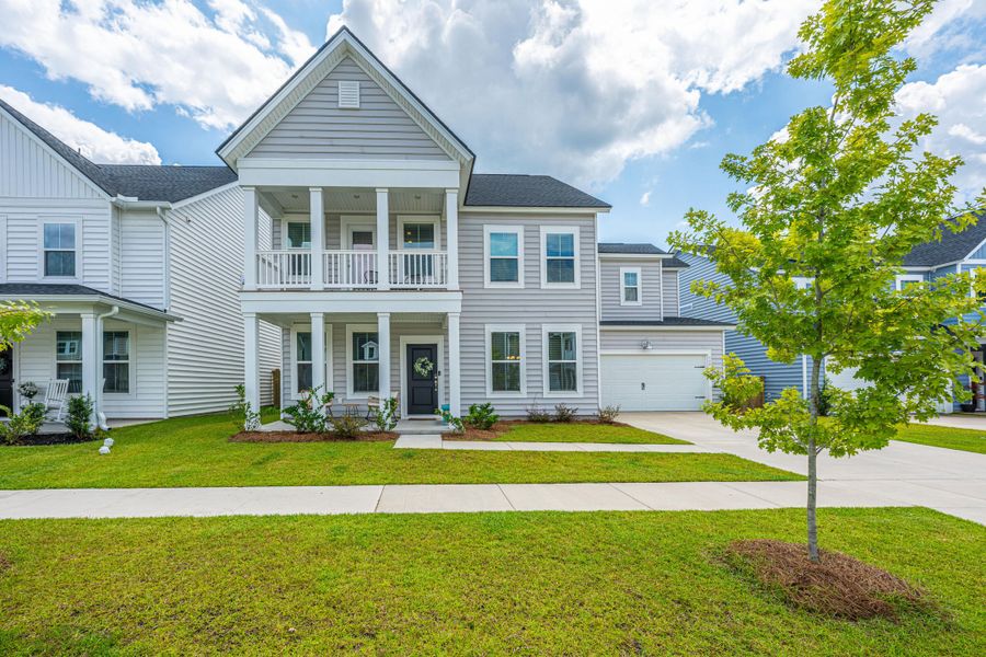 Front exterior of a new home in Heron's Walk at Summers Corner: Coastal Collection, Summerville, SC, highlighting curb appeal (Image 20).