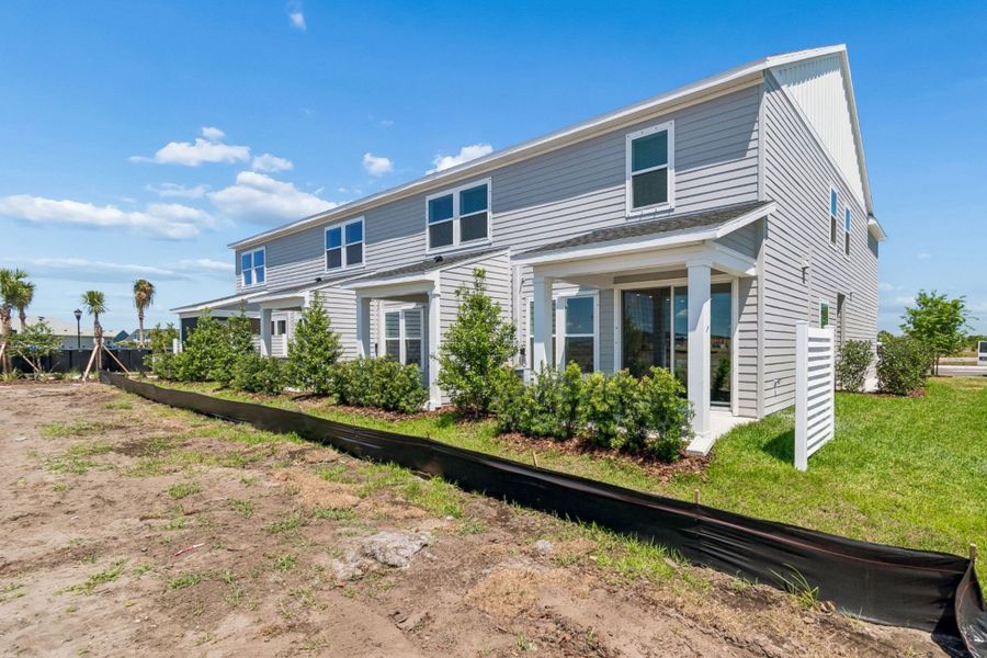 Representative exterior details of a home built from the The Peppermill by David Weekley Homes in Waterset Townhomes, Apollo Beach (Image 4).