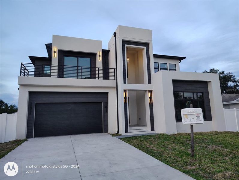 Front exterior of a new home in , Tampa, FL, highlighting curb appeal (Image 2).
