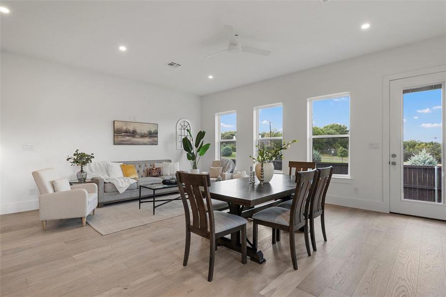 Dining area featuring recessed lighting, light wood-style flooring, and ceiling fan Dining area featuring recessed lighting, light wood-style flooring, and ceiling fan