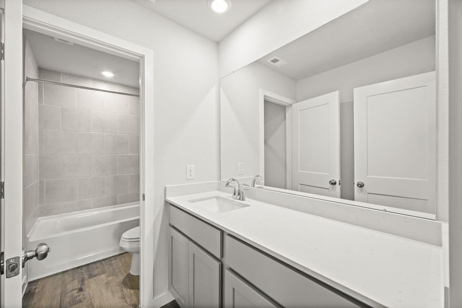 Furnished interior view inside a new home in Sunterra, Katy (Image 13).