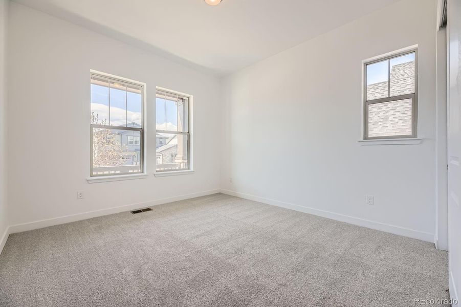 Spacious, unfurnished interior of a new home in Red Rocks Ranch: The Grand Collection, Morrison (Image 9).