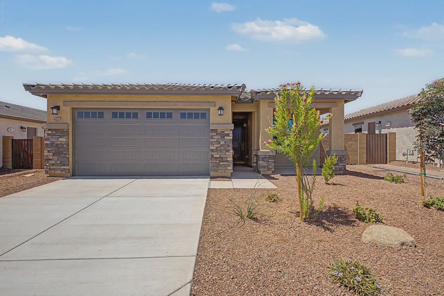 Front exterior of a new home in Avanti at Granite Vista, Waddell, AZ, highlighting curb appeal (Image 19). Front exterior of a new home in Avanti at Granite Vista, Waddell, AZ, highlighting curb appeal (Image 19).