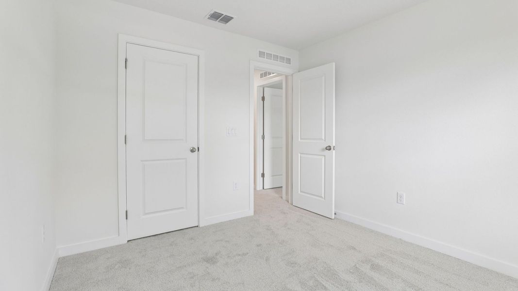 Furnished interior view inside a new home in Cyrene at Harmony, St. Cloud (Image 38).