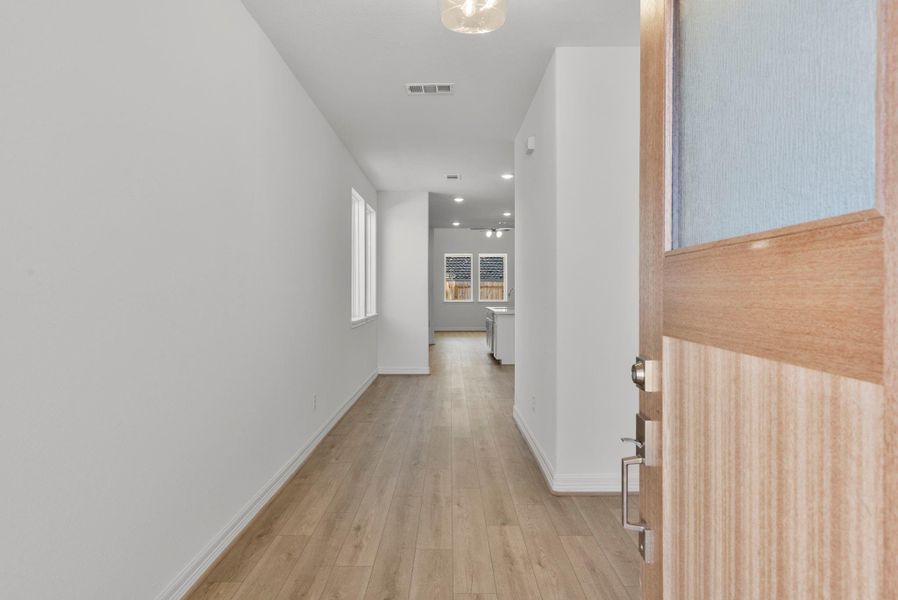 A warm welcome awaits with an entryway that naturally flows into the open-concept living space.”