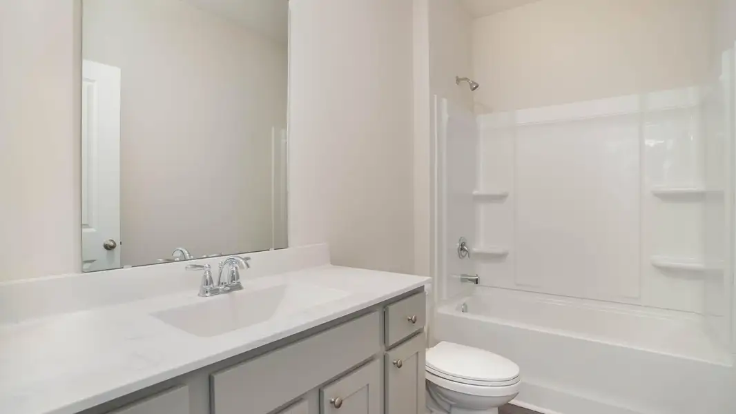 Representative furnished interior of a home built from the KERRY by D.R. Horton in Sandridge Park, Little River (Image 4).