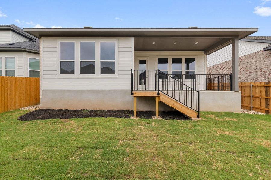 Exterior details and patio area of a home in Heritage, Dripping Springs (Image 26).