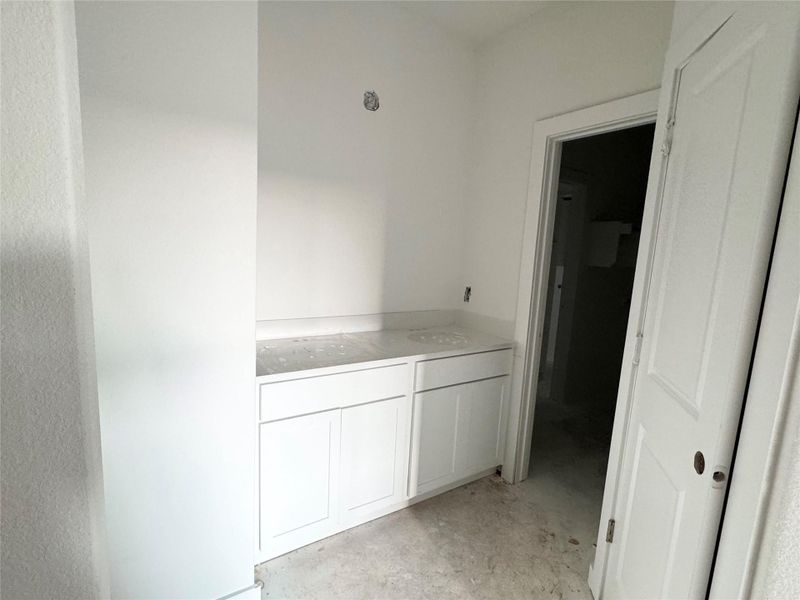 Corridor with concrete flooring