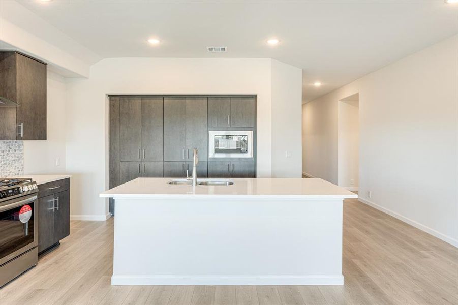 Furnished interior view inside a new home in East Oak Creek Elements, Commerce (Image 11).
