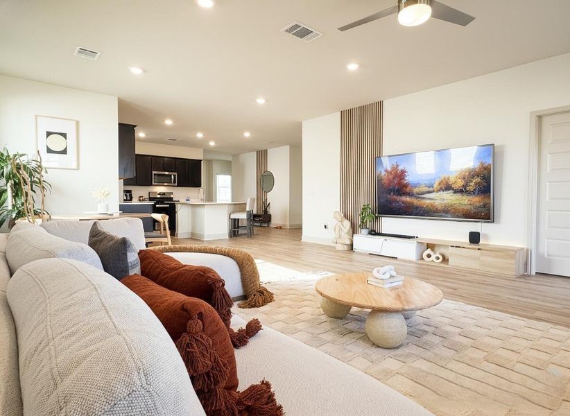 Living area featuring light wood-type flooring, recessed lighting, and ceiling fan