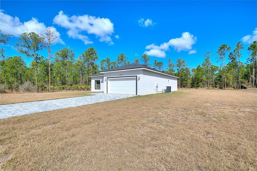 Exterior details and patio area of a home in , Indian Lake Estates (Image 25).
