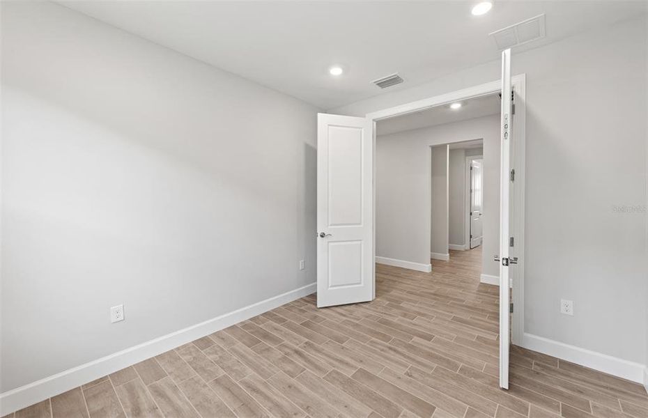 Spacious, unfurnished interior of a new home in Arbor Oaks, North Port (Image 19). Spacious, unfurnished interior of a new home in Arbor Oaks, North Port (Image 19).