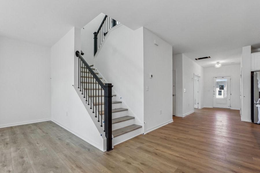 Representative unfurnished interior of a home built from the Macon by Ashton Woods in Rowland's Grant, Fuquay Varina (Image 37).