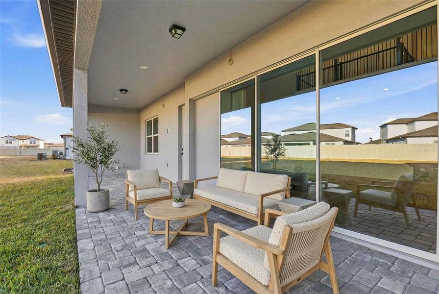 Exterior details and patio area of a home in Vida's Way, Wesley Chapel (Image 3).