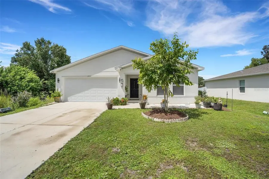 Front exterior of a new home in , Punta Gorda, FL, highlighting curb appeal (Image 1). Front exterior of a new home in , Punta Gorda, FL, highlighting curb appeal (Image 1).