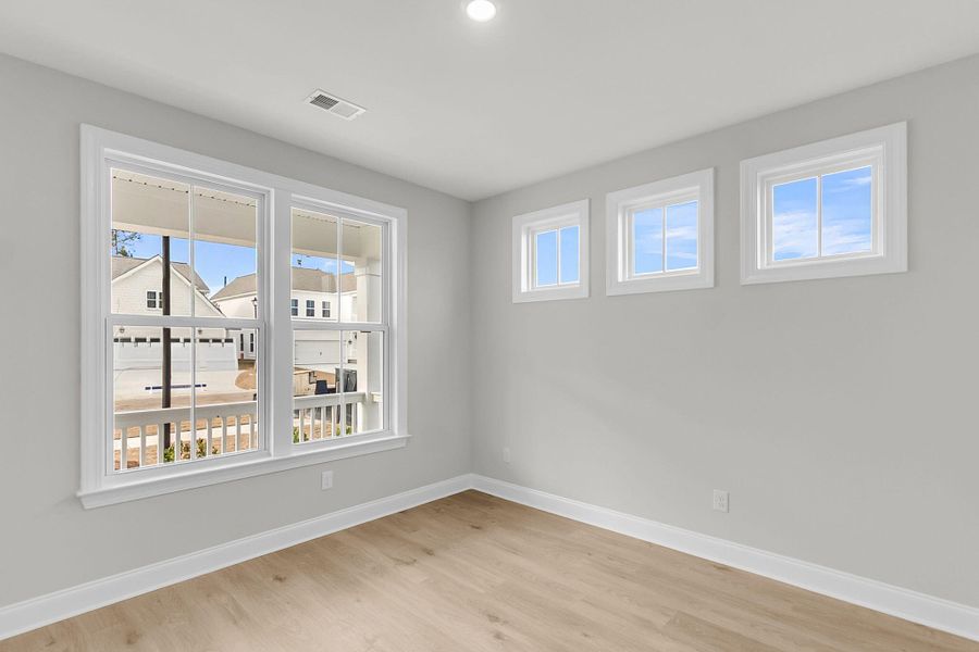 Spacious, unfurnished interior of a new home in Tidewater at Lakes of Cane Bay, Summerville (Image 20).
