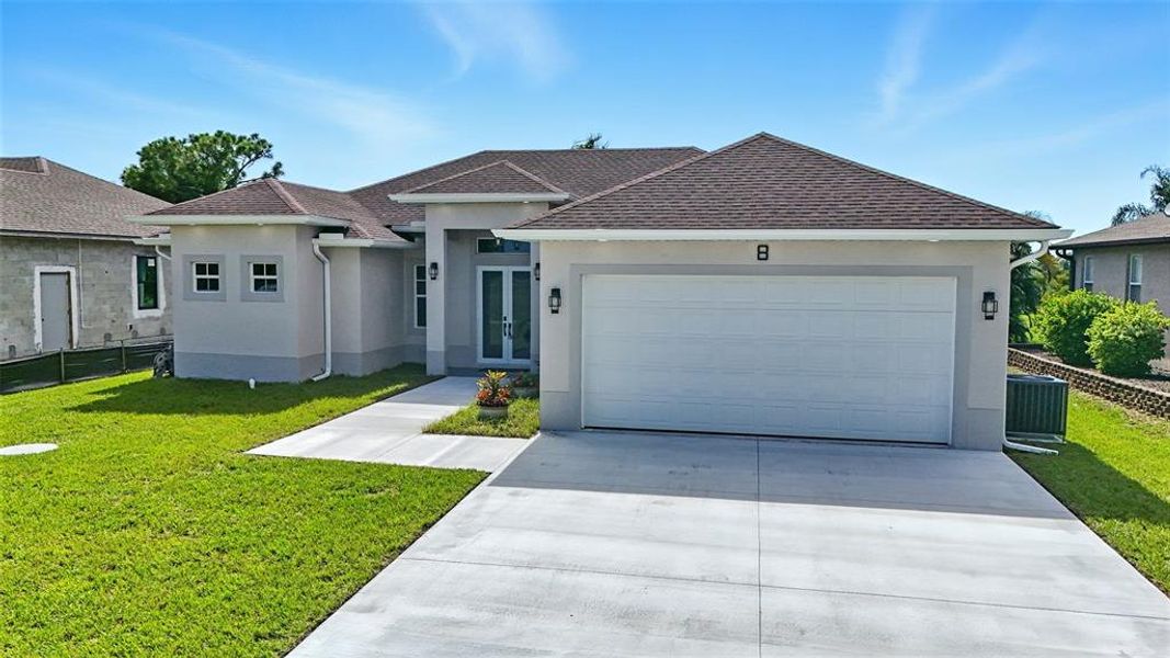 Front exterior of a new home in , Placida, FL, highlighting curb appeal (Image 2). Front exterior of a new home in , Placida, FL, highlighting curb appeal (Image 2).