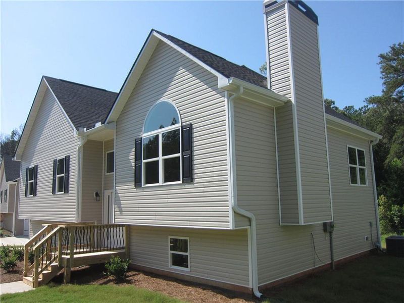 Front exterior of a new home in , Dallas, GA, highlighting curb appeal (Image 1).