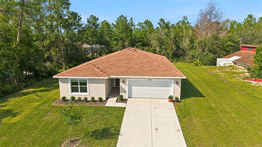 Front exterior of a new home in , Spring Hill, FL, highlighting curb appeal (Image 26).