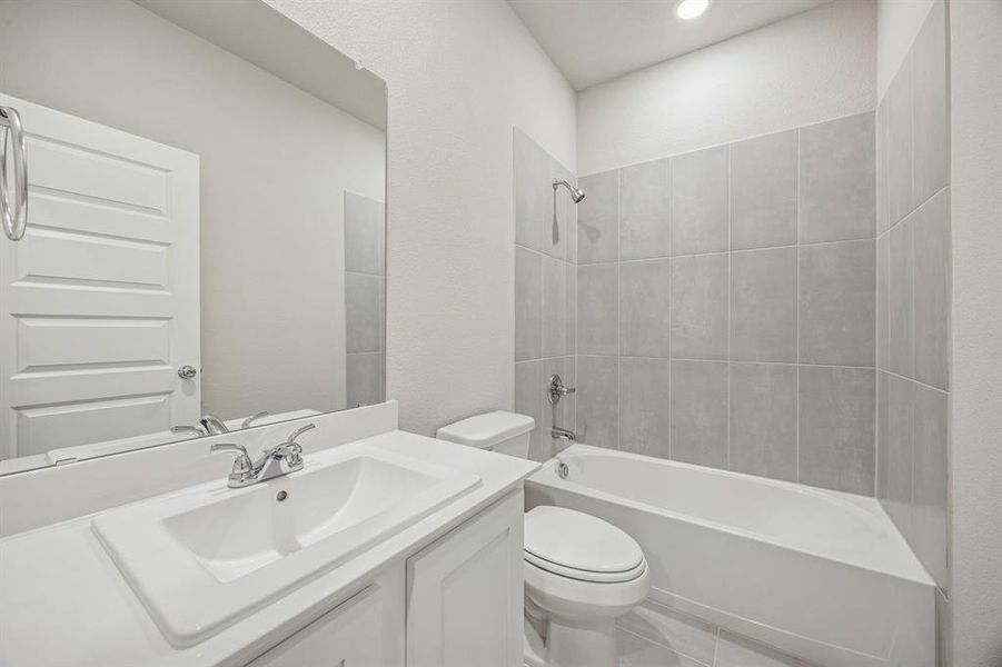 Bathroom in the Wimbledon home plan by Trophy Signature Homes – REPRESENTATIVE PHOTO