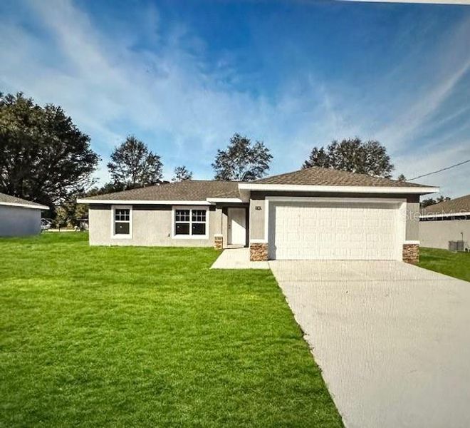 Front exterior of a new home in , Citrus Springs, FL, highlighting curb appeal (Image 1).