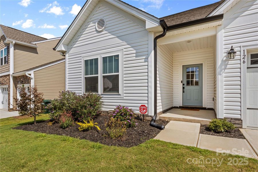 Front exterior of a new home in , Troutman, NC, highlighting curb appeal (Image 30).