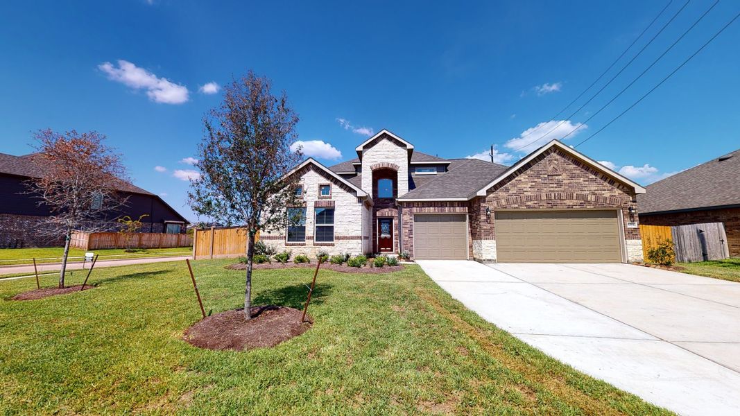Representative exterior photo of a completed home built from the Floor Plan 3256 by Colina Homes in Grand Magnolia, Magnolia, TX (Image 27).