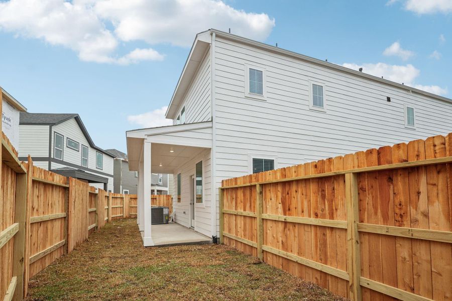 Exterior details and patio area of a home in Pinewood Trails - City Series, Atascocita (Image 26).