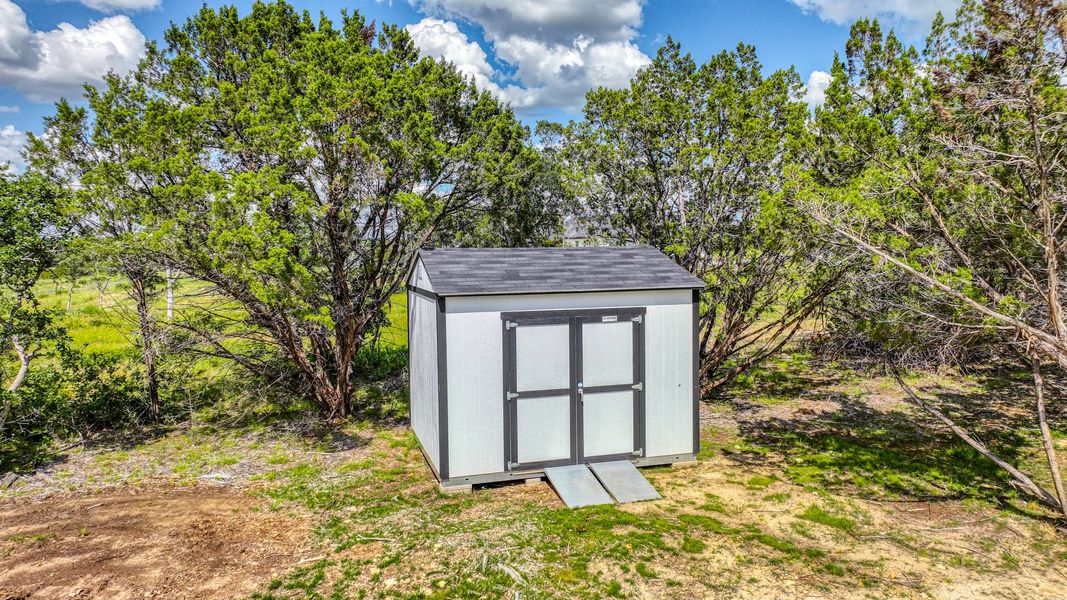Representative exterior photo of a completed home built from the Lakeshore by Zeal Home Builders in Oak Water Ranch, Granbury, TX (Image 16). Representative exterior photo of a completed home built from the Lakeshore by Zeal Home Builders in Oak Water Ranch, Granbury, TX (Image 16).