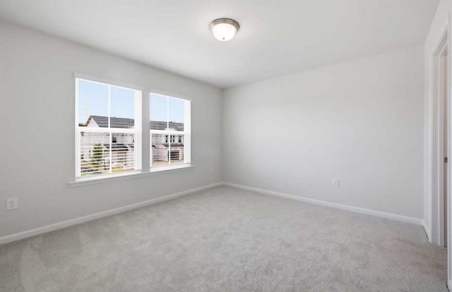 Spacious, unfurnished interior of a new home in Saunders Farm, Willow Spring (Image 19).