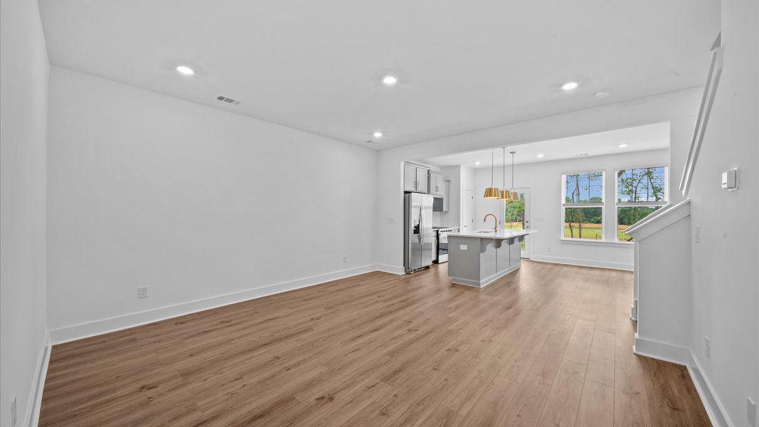 Hardwood flooring family room in two story townhome at Ransdell Pointe by DRB Homes in Spartanburg, SC