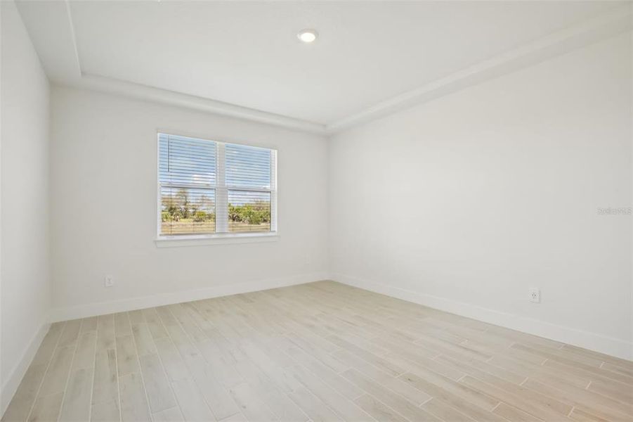 Spacious, unfurnished interior of a new home in Magnolia Bay - Reserve Series, Nokomis (Image 20).