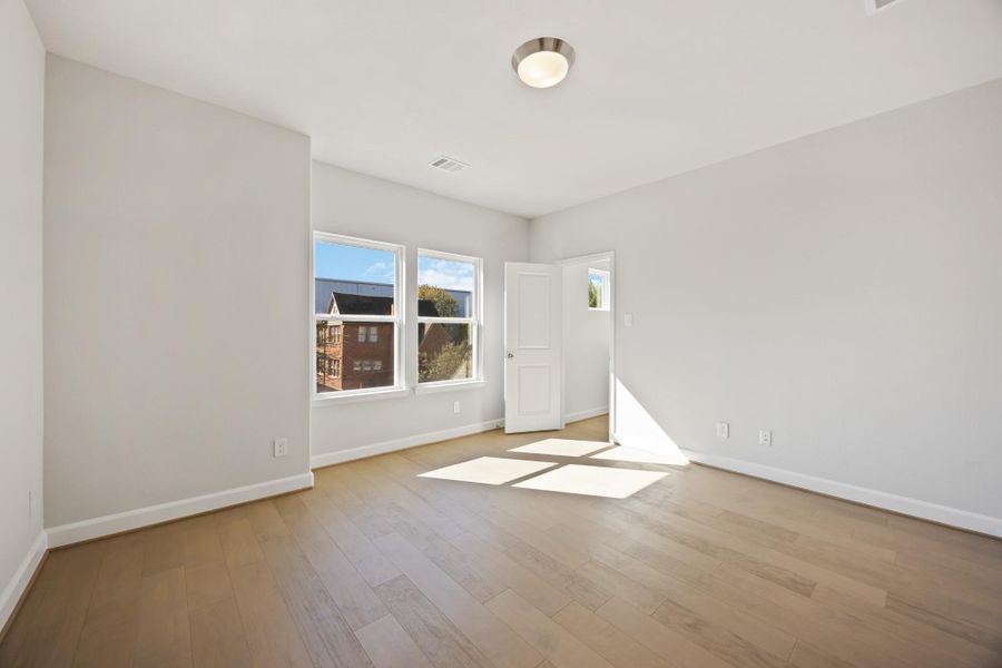 Sun-soaked and spacious, this secondary bedroom lives large with its bright street view and a true walk-in closet that makes staying organized effortless. Wood floors throughout keep the whole space feeling elevated and inviting. Sun-soaked and spacious, this secondary bedroom lives large with its bright street view and a true walk-in closet that makes staying organized effortless. Wood floors throughout keep the whole space feeling elevated and inviting.