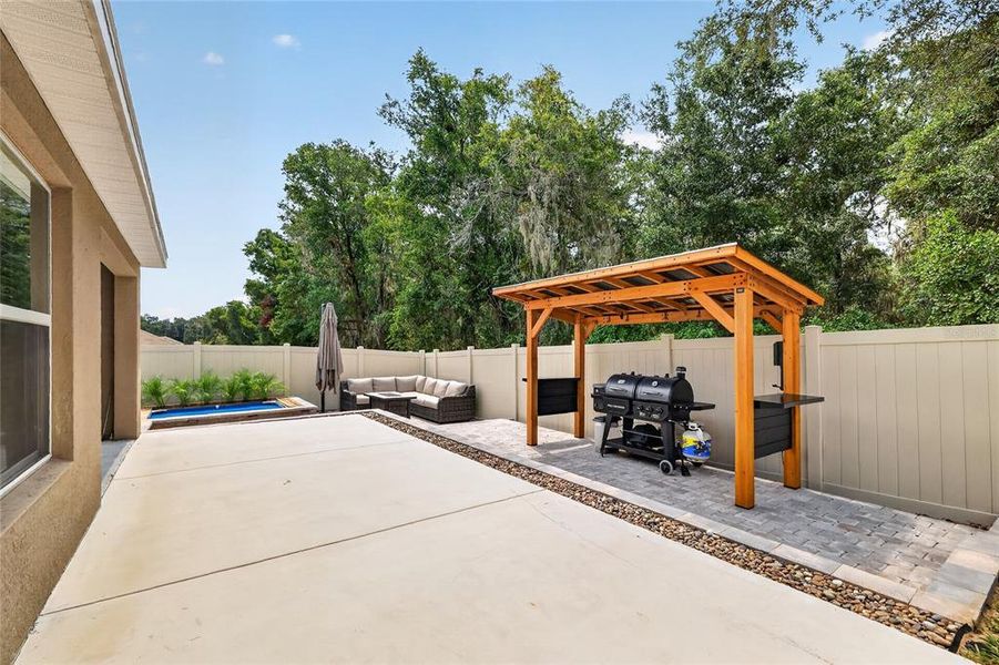 Exterior details and patio area of a home in Sunset Hills, Summerfield (Image 23).