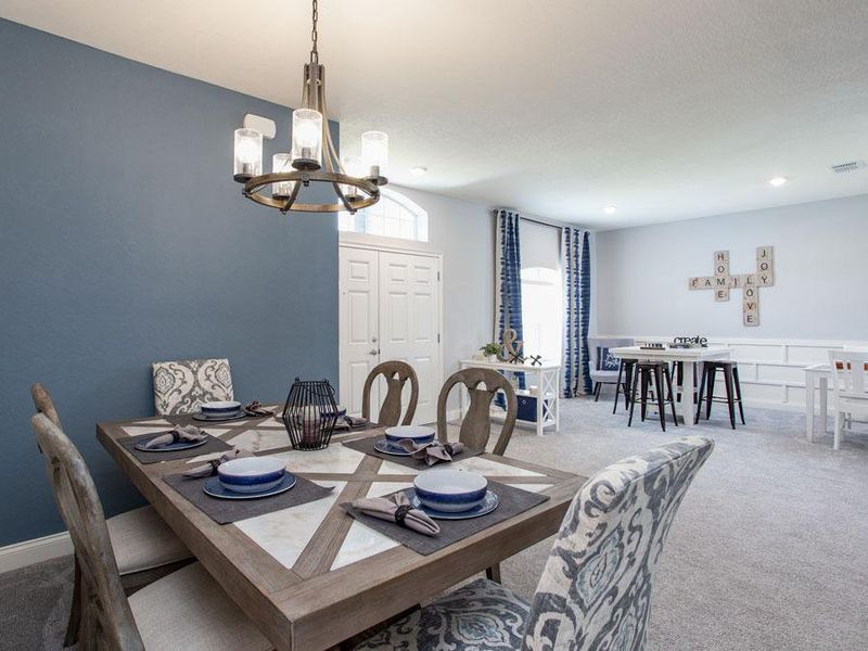 Open and versatile dining room and den located off the foyer and kitchen - Westin ll home plan by Highland Homes