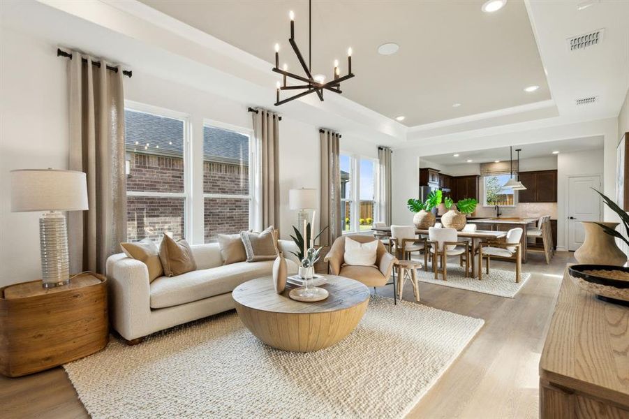 *Model Representation - Spacious gathering room with large windows