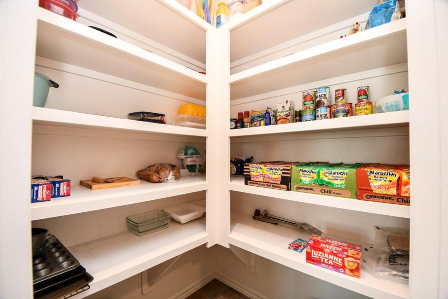 Spacious pantry, perfect for your various kitchen items, providing ample storage space.