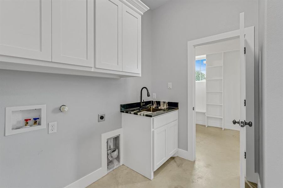 Laundry room with cabinet space, washer hookup, electric dryer hookup, baseboards, and hookup for a gas dryer