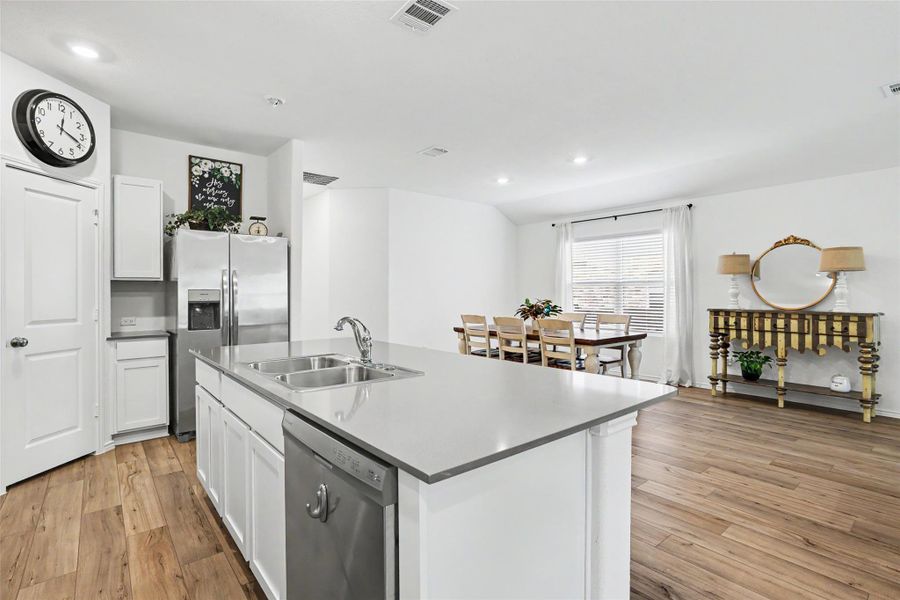 Kitchen island with dual stainless steel sink and integrated dishwasher
