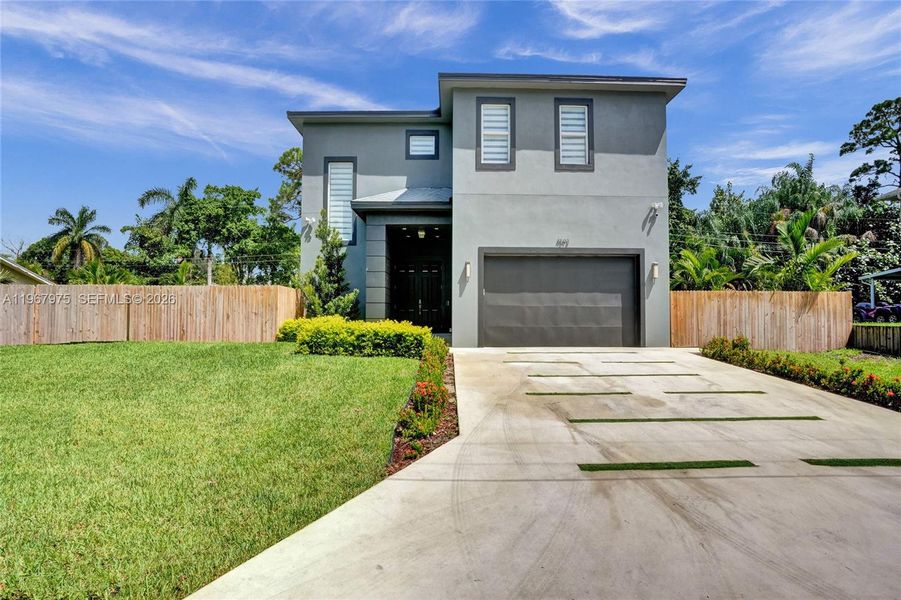 Front exterior of a new home in , Lake Worth, FL, highlighting curb appeal (Image 1). Front exterior of a new home in , Lake Worth, FL, highlighting curb appeal (Image 1).