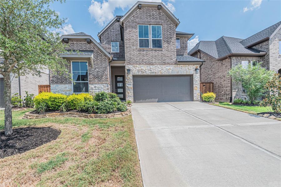 Front exterior of a new home in , Fulshear, TX, highlighting curb appeal (Image 15). Front exterior of a new home in , Fulshear, TX, highlighting curb appeal (Image 15).