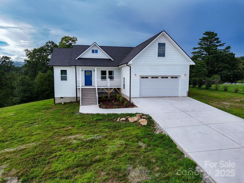 Front exterior of a new home in , Hendersonville, NC, highlighting curb appeal (Image 28). Front exterior of a new home in , Hendersonville, NC, highlighting curb appeal (Image 28).