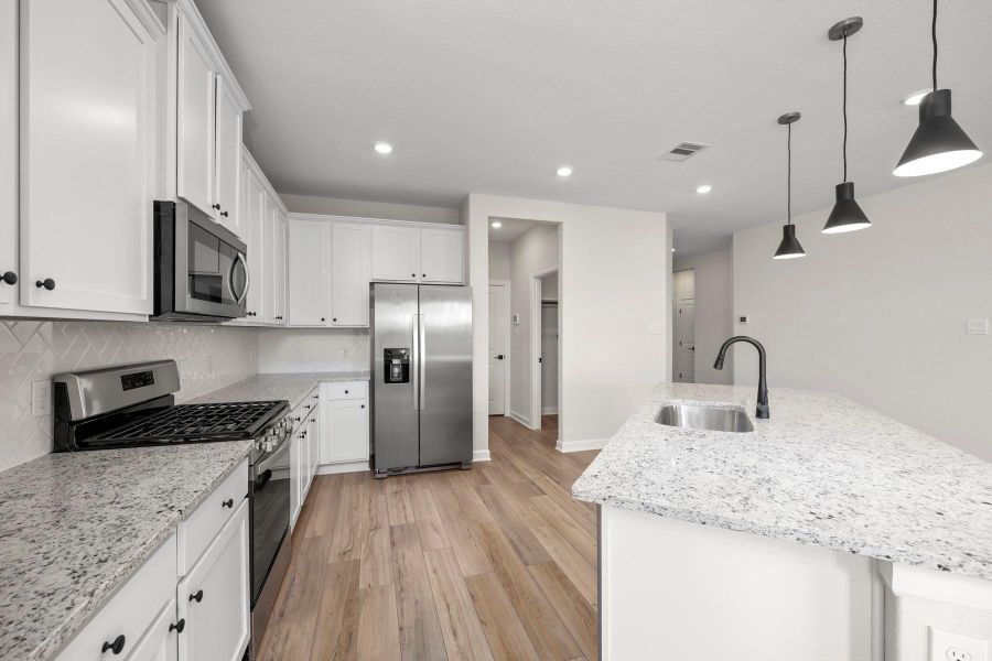 Furnished interior view inside a new home in Sunterra, Katy (Image 5).